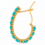 Gold hoop earring with turquoise beads on a white background