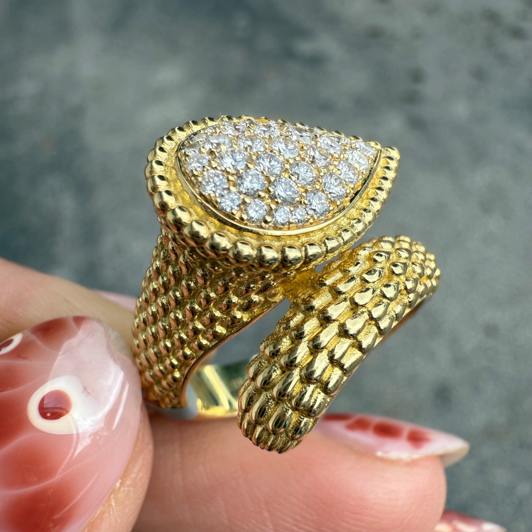 Diamond wrap ring in 18K yellow gold with textured dragon scale design