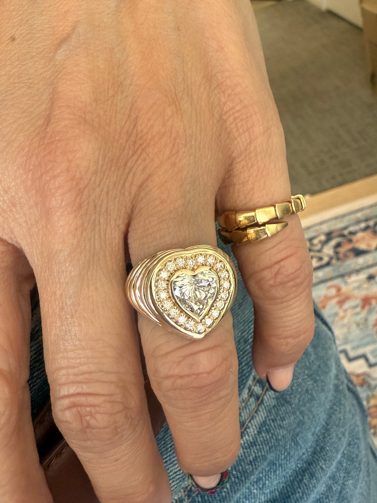 Hand showing  lab diamond heart ring at Santayana Jewelers in Miami. 
