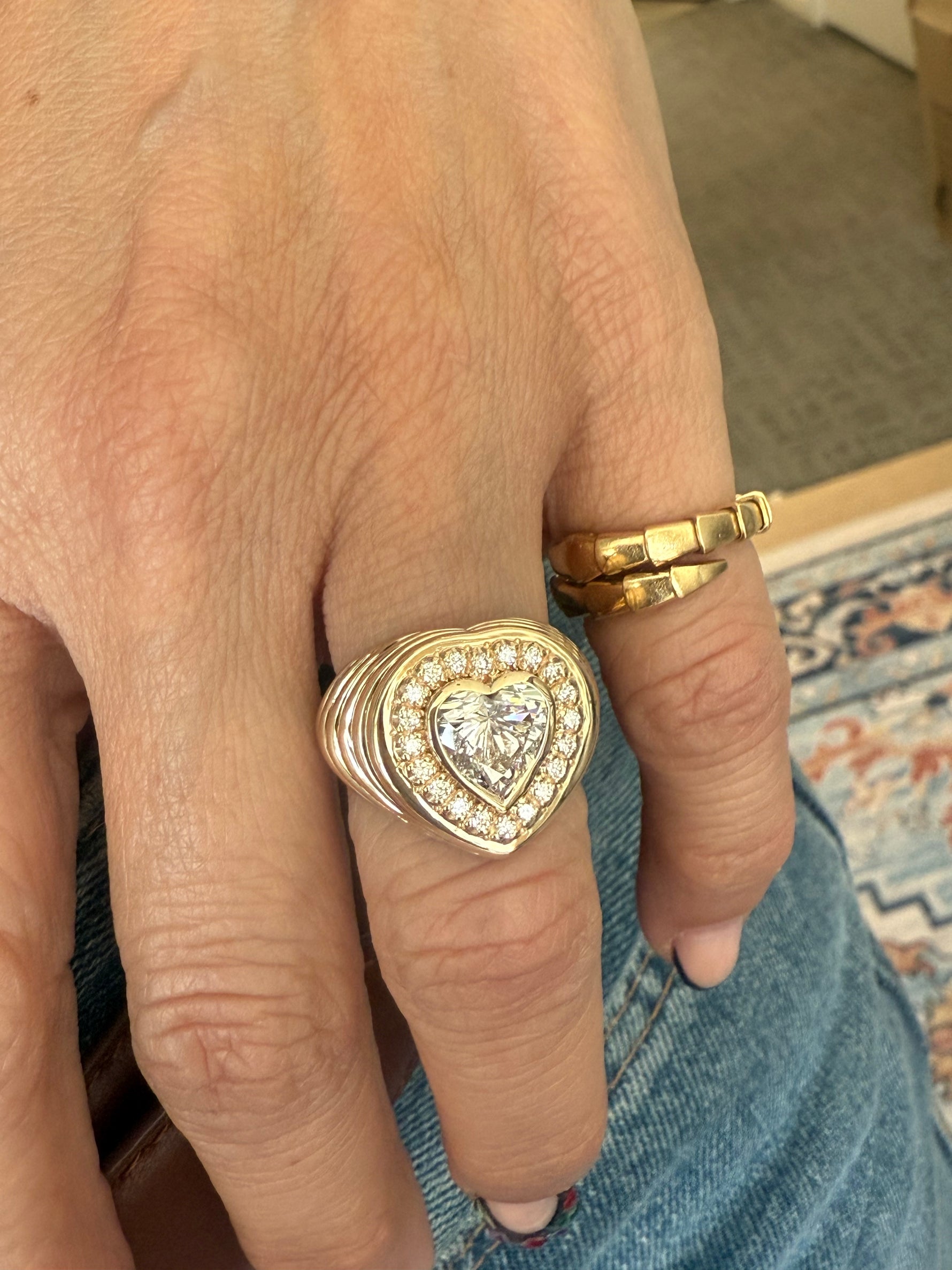 Hand showing  lab diamond heart ring at Santayana Jewelers in Miami. 