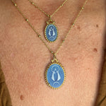 Sterling silver and gold plating pendant necklace with a blue agate image of La Caridad del Cobre, the patron saint of Cuba.