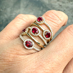 Hand view of ruby and diamond halo ring, taken at Miami jeweler fine jewelry