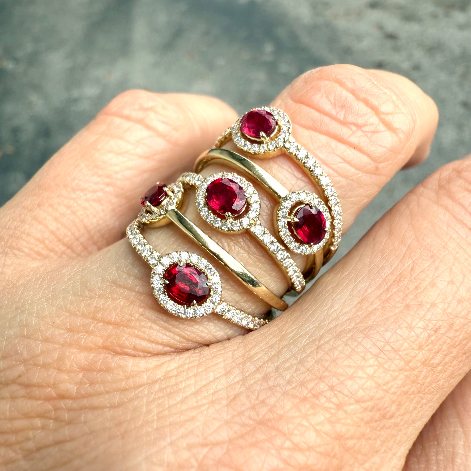 Hand view of ruby and diamond halo ring, taken at Miami jeweler fine jewelry