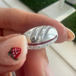 Silver bracelet charm of 'Cuban Bread'