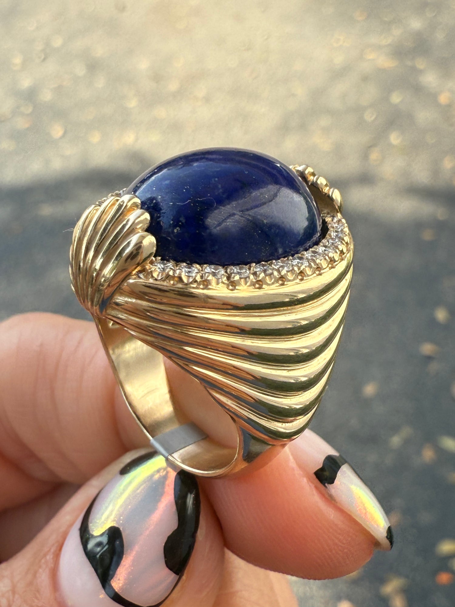 Side view of Statement ring in 14K yellow gold with lapis and diamonds. 