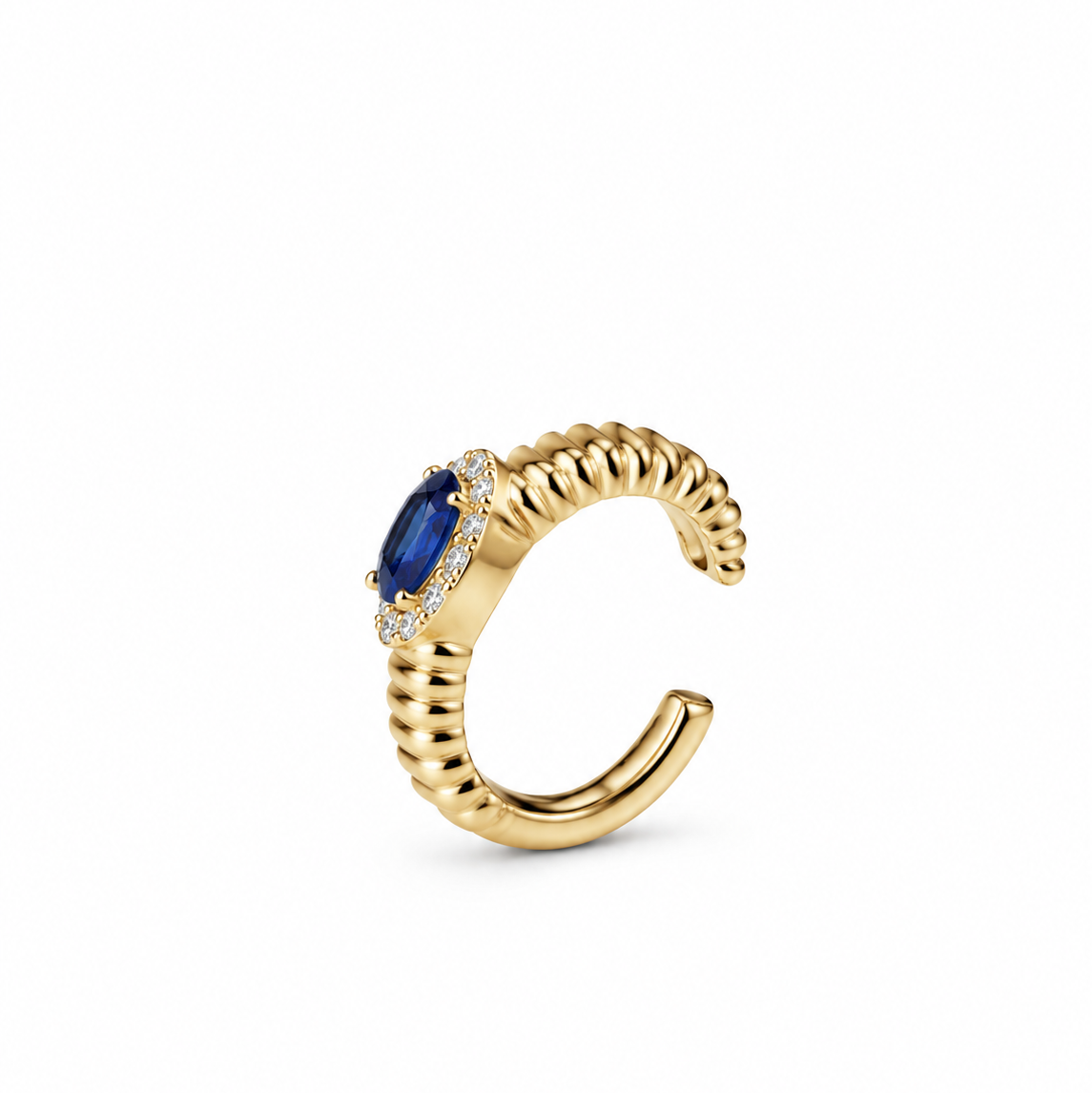 Gold ear cuff featuring a central oval blue sapphire stone surrounded by a halo of diamonds, set against a plain white background.