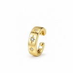 A polished gold huggie hoop earring featuring three star-shaped diamond accents, shown on a clean white background.