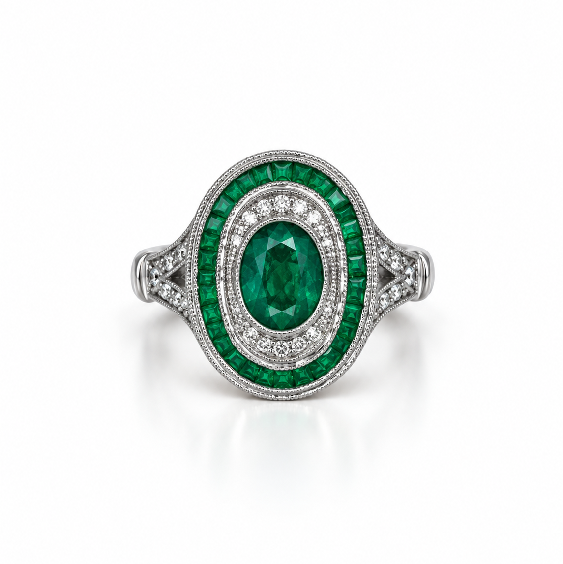 An oval emerald ring with 18k white gold pavé band, featuring a central emerald surrounded by round-cut diamonds.