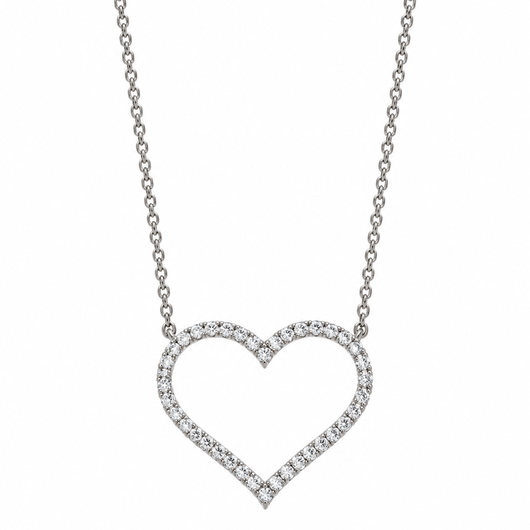 Big white gold diamond cross against a white backdrop.
