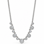 A white gold diamond necklace featuring a central round diamond pendant flanked by smaller round diamond clusters, suspended from a delicate double chain on a white background.