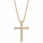 A gold cross pendant necklace adorned with diamonds, hanging from a delicate gold chain against a plain white background.