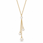 A delicate gold chain necklace featuring three cascading dangles of small gold chains ending in white pearl beads, shown against a plain white background.