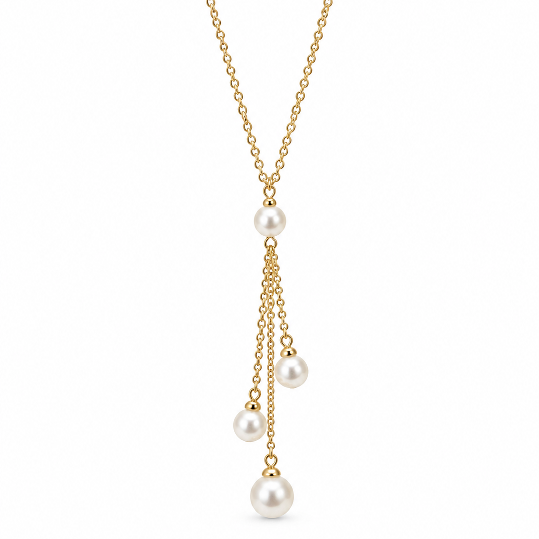 A delicate gold chain necklace featuring three cascading dangles of small gold chains ending in white pearl beads, shown against a plain white background.