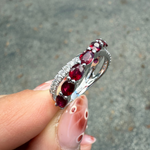 side view of ruby and diamond crossover band in 14K white gold, versatile ring