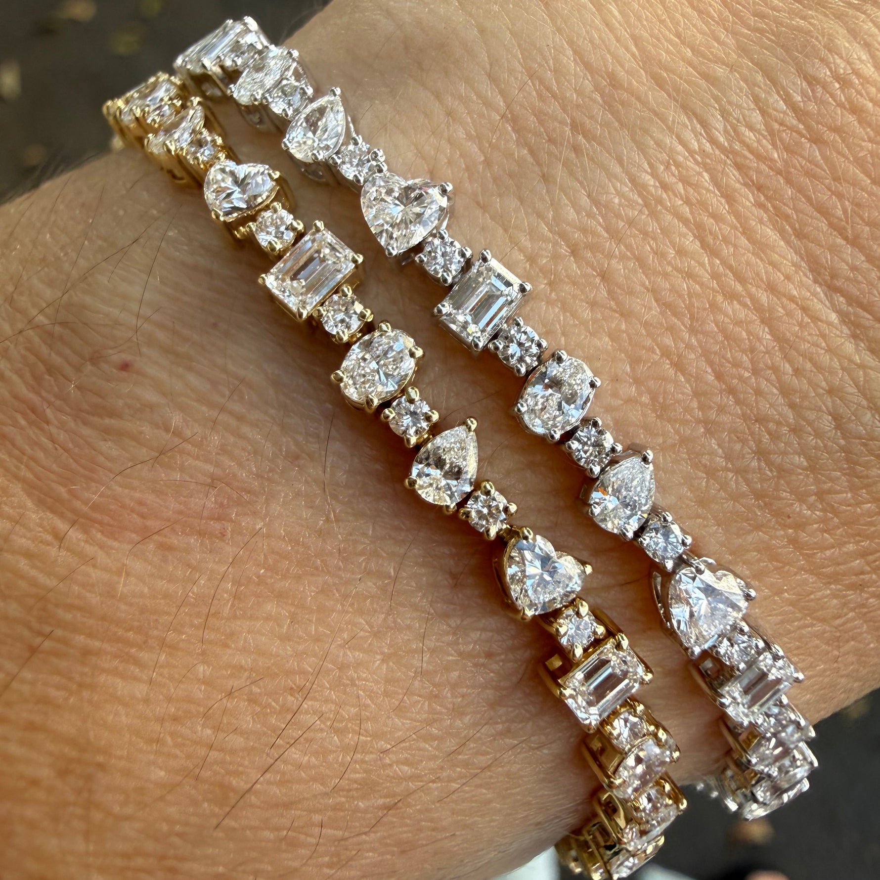 White and yellow gold multi shape lab diamond tennis bracelet on wrist